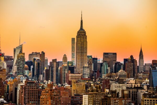 A panorama of NYC skyscrapers at sunset